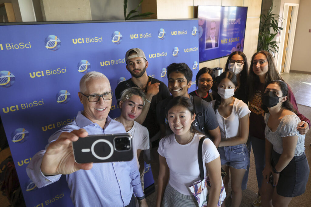 In this picture: Dean Frank Laferla taking a selfie with UC Irvine Dunlop School undergraduates at Donuts with the Dean.